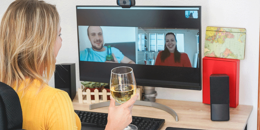 Woman at computer doing a virtual wine tasting